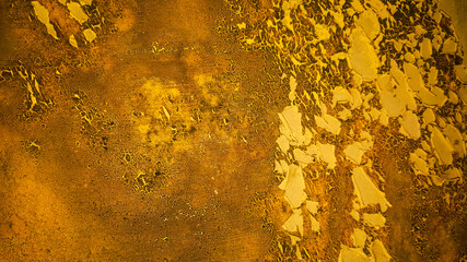 Gold Wall texture background of the house wall paint that is affected by weather conditions