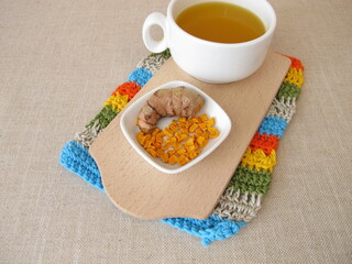 Golden yellow tea with dried turmeric 
