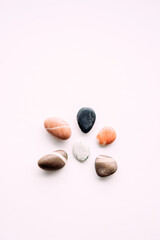 flat lay of sea pebbles on light background. abstract wallpaper