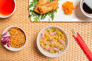 Chinese food table, spring rolls, Cantonese rice, chopsticks, soy