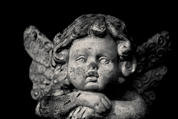Old angel statue on grave at Alastaro, Finland. 