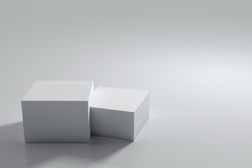 A pedestal for subject shooting in the form of two cubes: a larger and a smaller one. Gray background for subject placement. 3D rendering.