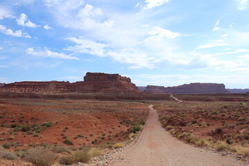 Fototapeta na wymiar Scenic drive with a gorgeous southwest desert landscape featuring canyons and sandstone buttes in Valley of the Gods, Utah