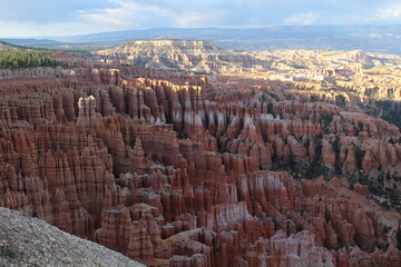 Bryce Canyon National Park is a canyon within a mountain valley that hosts very unique and colorful geologic structures called hoodoos. 