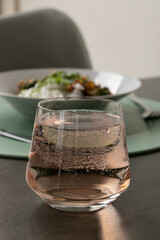 Glass of juice water with bubbles 