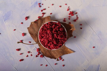 dried freeze dried raspberries are on the table with tea