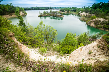 Fototapeta na wymiar Beautiful landscape, blue lake with an island in the middle in the middle of the forest