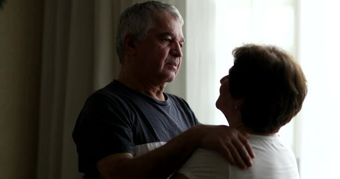 Older couple embrace, senior emocional intimacy. middle aged husband hugging and caring for wife