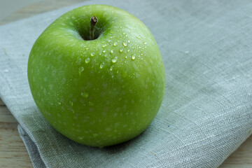 Close up of one whole green fresh apple 