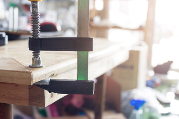 Woodworking clamps are used to hold the wood together using glue as a binder.