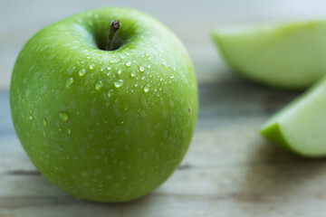 Close up of one whole green fresh apple 