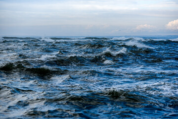 Naklejka na ściany i meble A rough ocean, rough waves on the ocean off the coast of France.