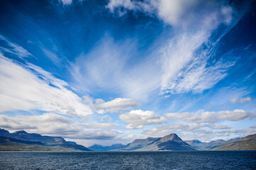 Beautiful Icelandic landscape, volcanic mountains and beautiful clouds.