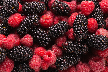 Tasty raspberry and blackberry background.