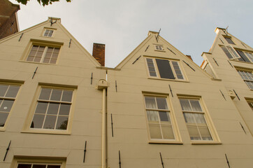 Twin houses in front of a channel in Amsterdam
