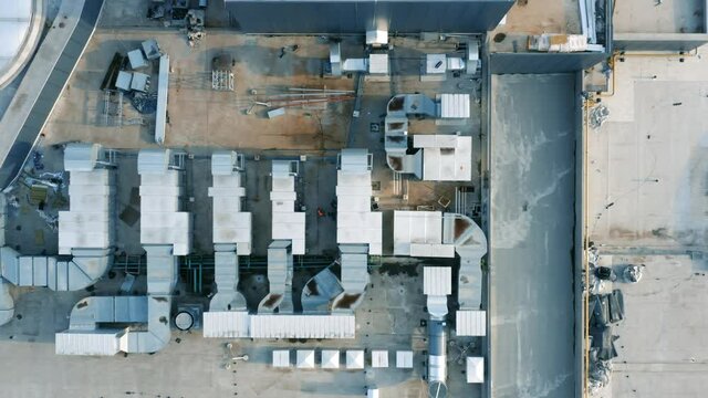 Ventilation and air conditioning systems installed on the rooftop. Aerial top down view