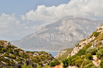 Fototapeta na wymiar Panoramic view of the bay of Marathokampos on the Greek Aegean island of Samos with the Kerkis mountain range in the background.