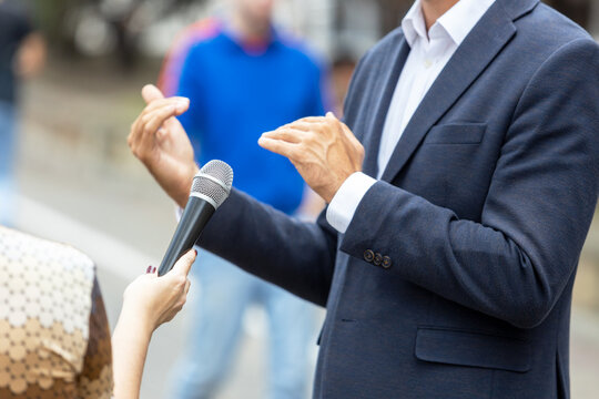 Journalist Making Media Interview With Unrecognizable Person. Vox Populi Concept.