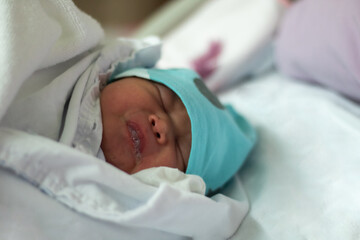 New Born Baby Girl Sleeping on Hospital Bed