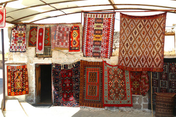 Persian carpet and rugs in Turkey. Oriental moroccan rugs hanging on the market. 