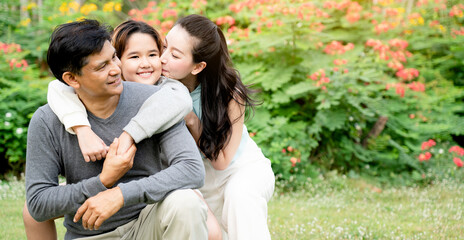 Asian family is stand the park, which is ideal for long weekend vacations. Taking care of family makes children feel the love of parenting. Family health insurance is a good plan.