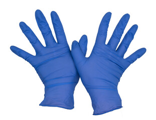 Hands wearing blue nitrile examination gloves, thumbs crossing, fingers fanned apart, palms down.  Female hand isolated, no skin