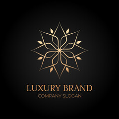 Flower logo golden luxury branding vintage concept with dark background for restaurant, spa, hotel business
