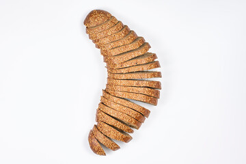 Sliced wheat bread. Homemade in the form of semicircle on a white background. Top view.