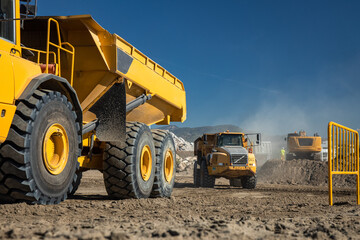 Industrial dump trucks working in a construction in the city of Malaga - excavation and movement of...