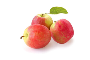 Three tasty red apples with leaf isolated on white