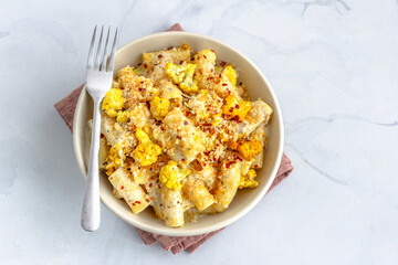 Pasta with Roasted Cauliflower with Breadcrumbs and Chili Flakes Directly Above Horizontal Photo
