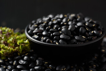 Close up of organic black beans in healthy food concept