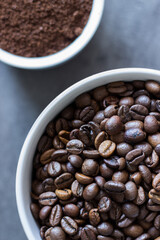 Close up of roasted coffee beans and ground coffee 