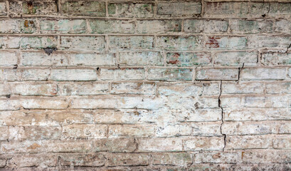 Old brickwork with crumbling plaster. Building wall. Graphic resources. Background. Vintage. Retro.
