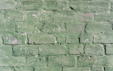 Old brickwork with crumbling plaster. Building wall. Graphic resources. Background. Vintage. Retro.