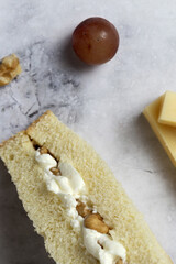 Obraz na płótnie Canvas Homemade cheese with walnuts sandwiches