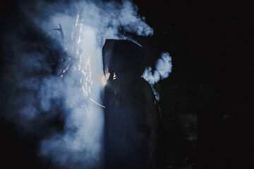 Sorcerer with marks on his body in the forest