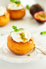 Rum woman (brioche) with cream and passion fruit. Dessert. Selective focus