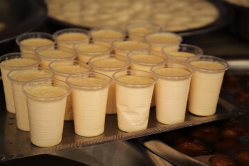 Local yogurt decorated inside plastic cup at a local market in Bangladesh