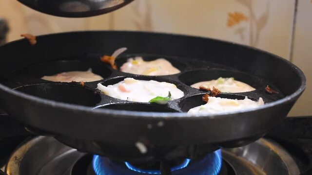 Close up shot of south Indian food Apam being cooked on stove