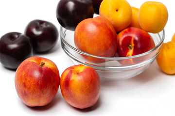 Naklejka na ściany i meble nectarine, peach and plum on a white background