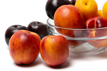 Fototapeta na wymiar nectarine, peach and plum on a white background