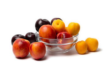 nectarine, peach and plum on a white background