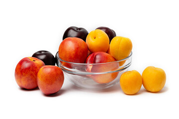 nectarine, peach and plum on a white background