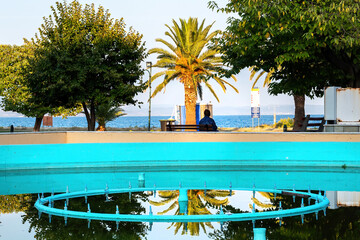 Birch fountain with the sea and trees on the background in Asprovalta