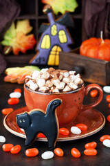 Halloween  time composition with cookies and hot chocolate mug