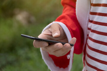 Santa Claus using the cell phone.