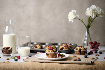 mixed berry low carb Keto Diet muffin with almond and nut. set on cafe table.