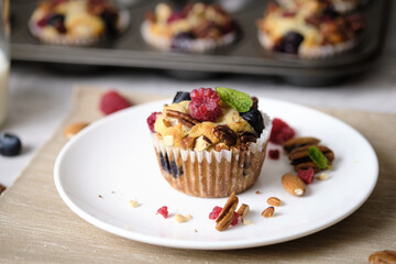 mixed berry low carb Keto Diet muffin with almond and nut. set on cafe table.