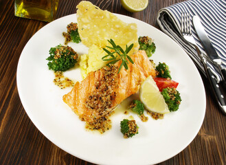 Grilled Salmon Steak with Broccoli, mashed Potatoes Cheese Cracker on wooden Background